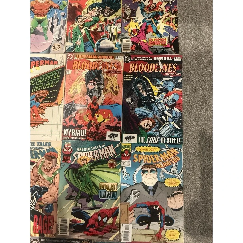 Vintage 15 lot of superhero comic books from both DC and Marvel publishers.